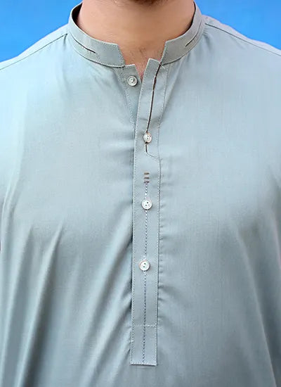 Close-up of the green muted kurta’s fine stitching, showcasing quality wash n wear fabric and elegant button detailing.