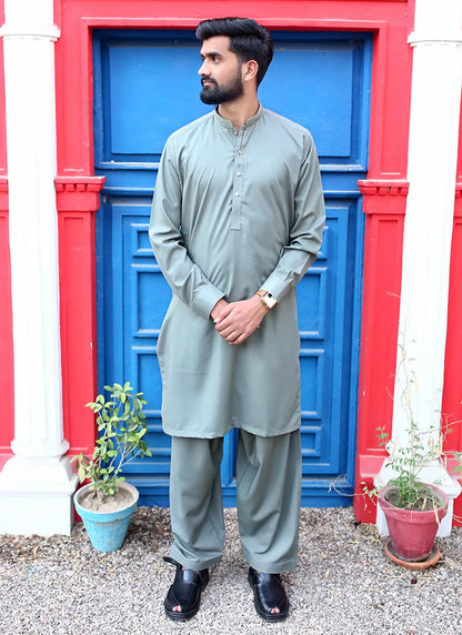 Front view of a men’s green muted kurta shalwar made from wash n wear fabric
